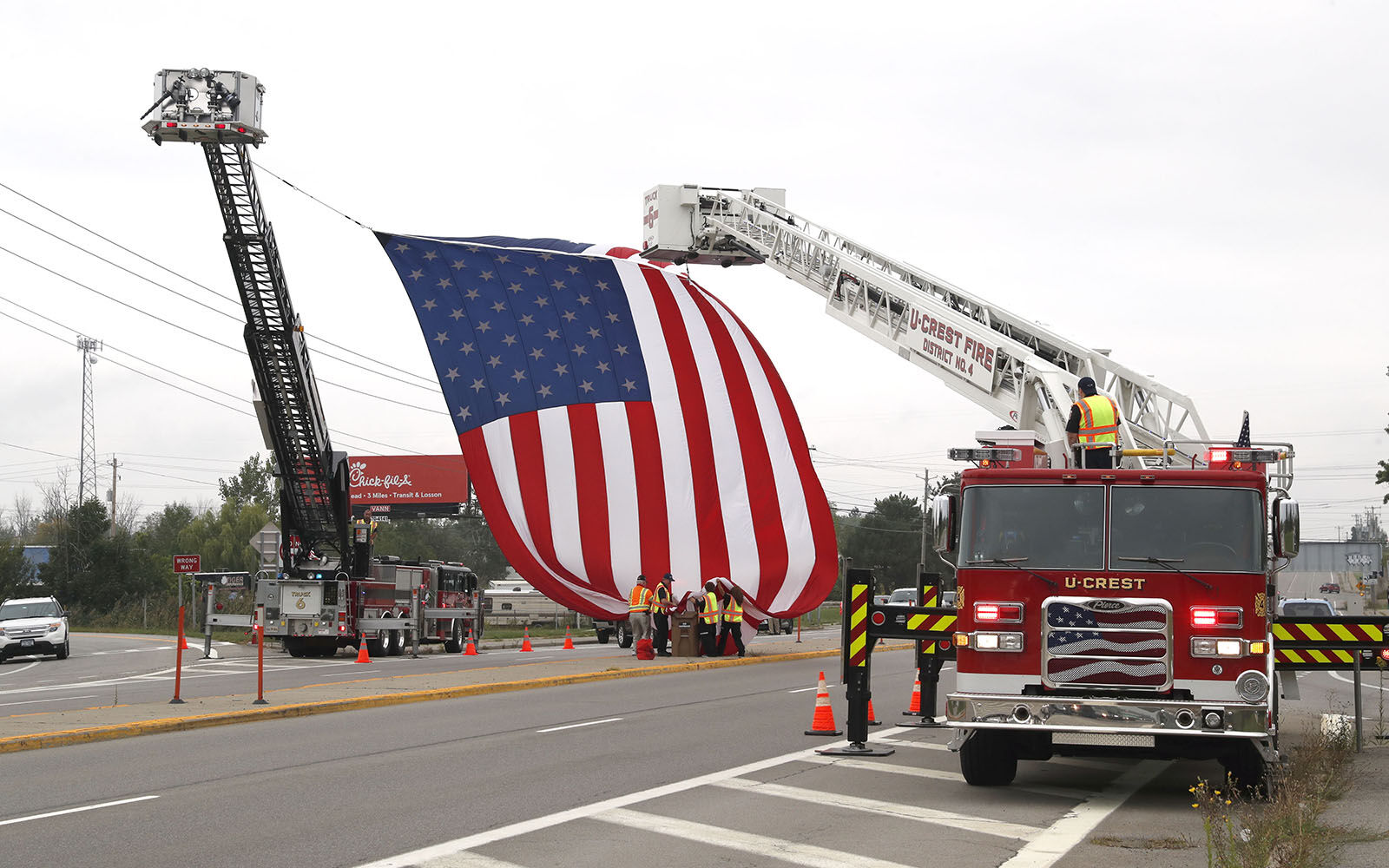 Giant flag on Transit Rd for firefighter
